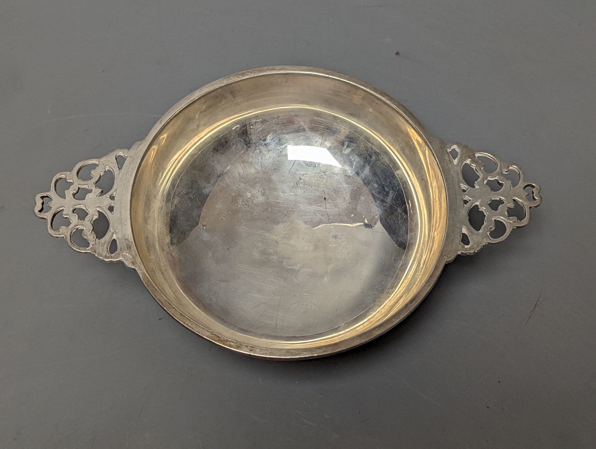 A George VI Scottish silver silver quaich, with pierced handles and engraved inscription, by H.D. Falconer & Son, Glasgow 1947, 20.2cmm over handles,7.5oz.